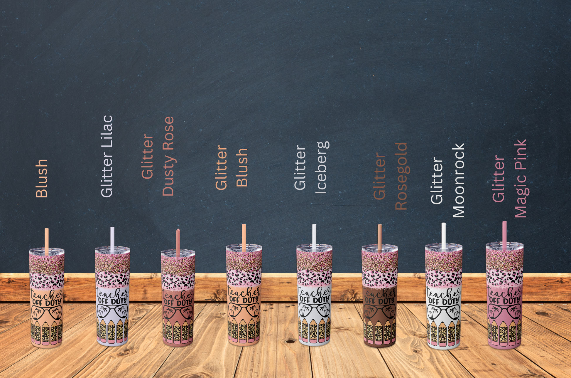 Row of colorful tumblers with various designs on a wooden surface and dark background