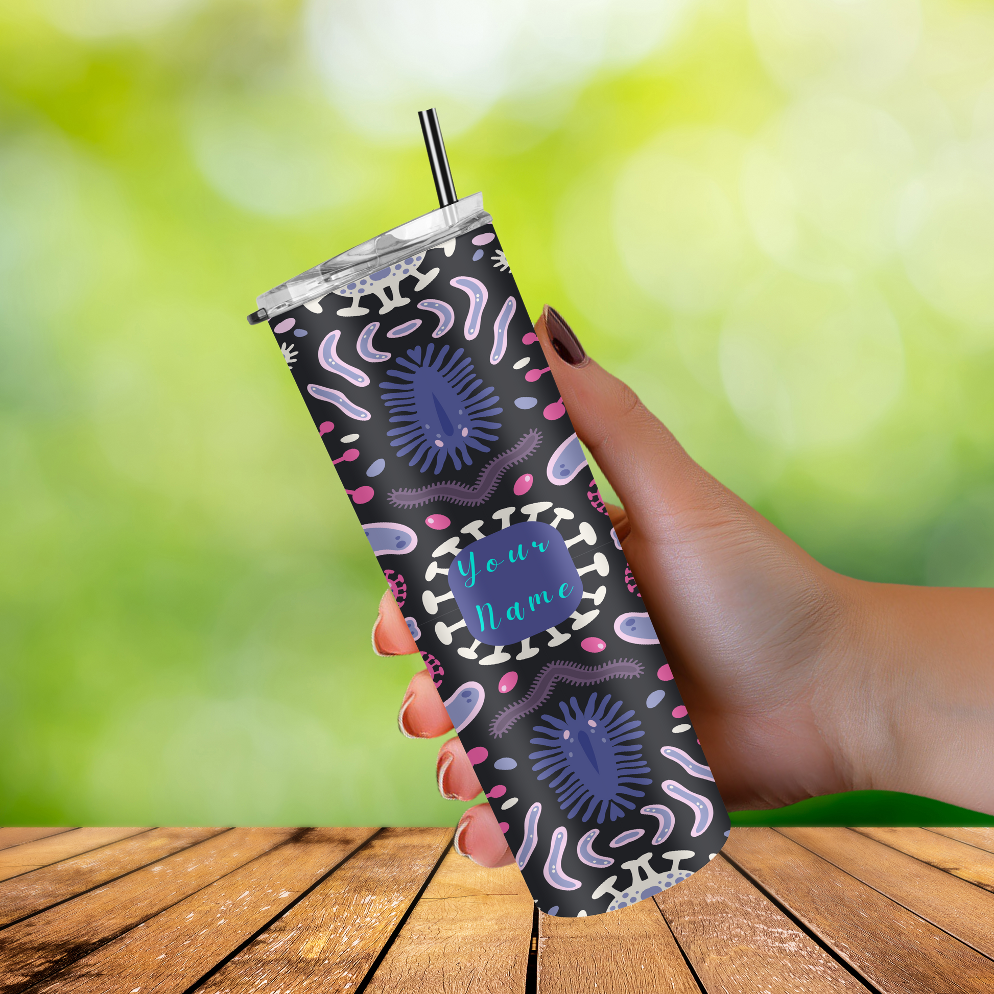"Personalized tumbler with a biology design, including images of microscopes, DNA helixes, and cells on a sleek black background."
