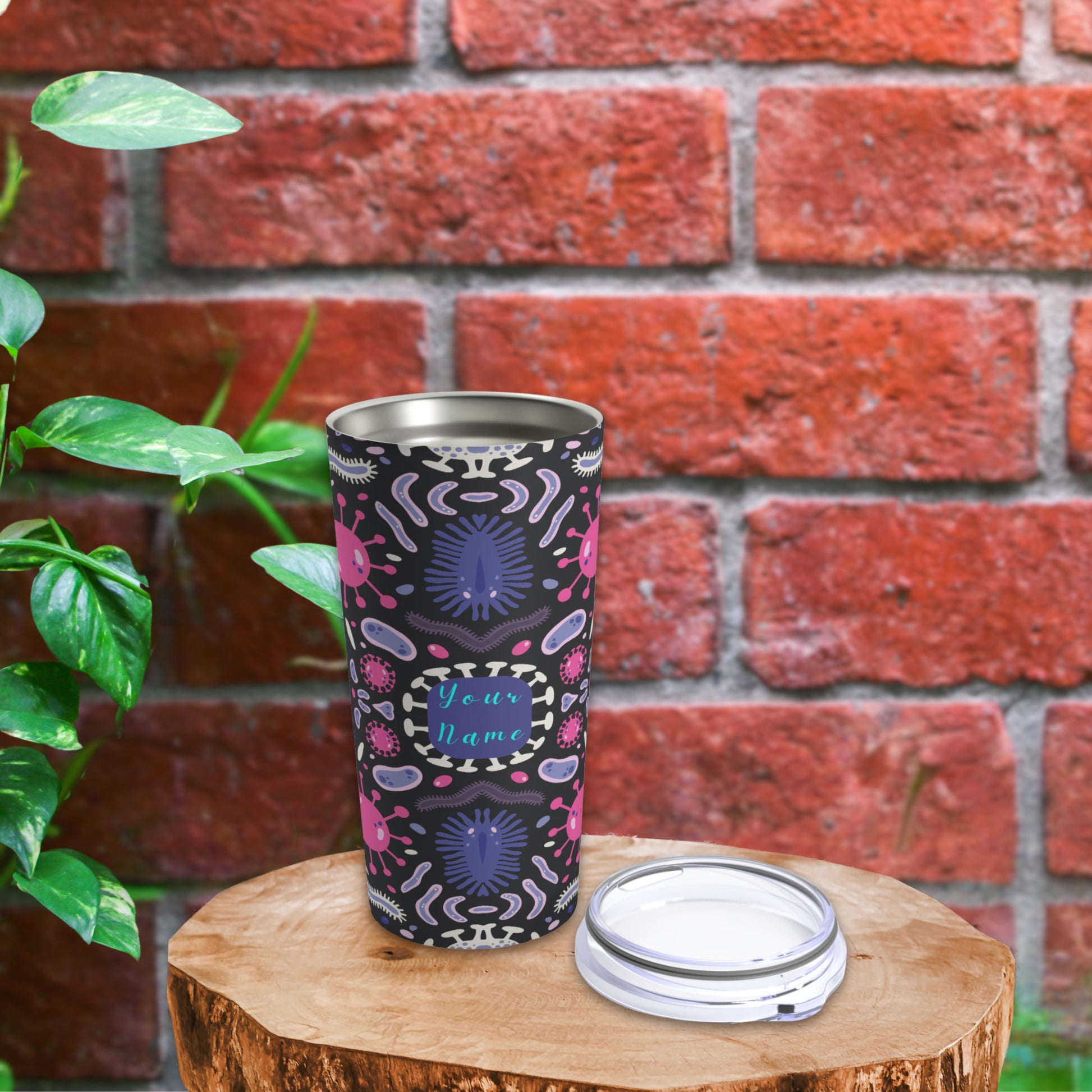 "Personalized tumbler with a biology design, including images of microscopes, DNA helixes, and cells on a sleek black background."
